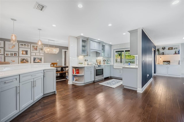 kitchen featuring stainless steel electric range oven, dark wood-style floors, visible vents, gray cabinets, and light countertops