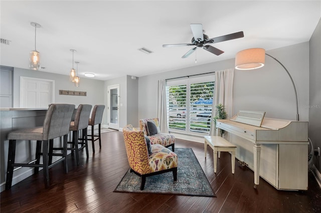 interior space featuring visible vents, ceiling fan, and hardwood / wood-style flooring