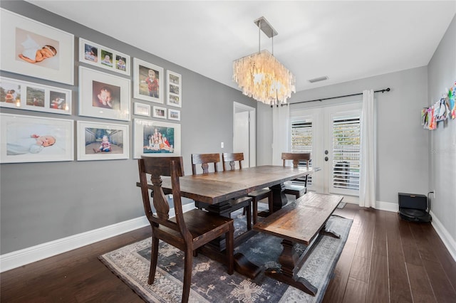 dining area featuring a notable chandelier, french doors, baseboards, and dark wood-style flooring