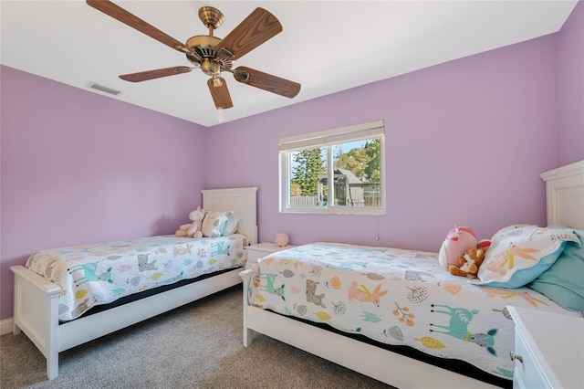 bedroom featuring visible vents, carpet floors, and ceiling fan