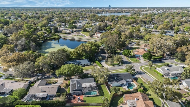 birds eye view of property with a residential view and a water view