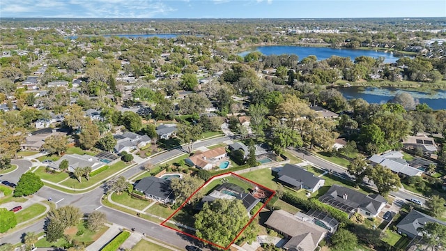 birds eye view of property with a residential view and a water view