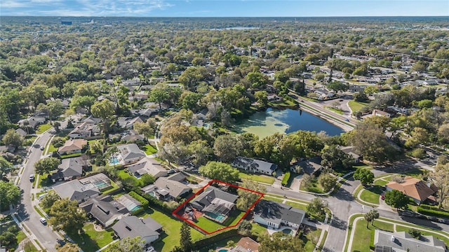 drone / aerial view with a residential view and a water view