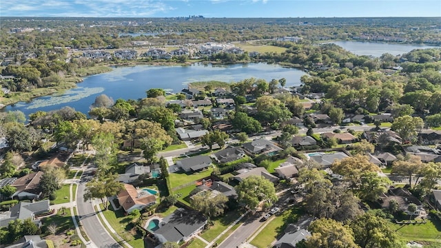 birds eye view of property with a water view and a residential view