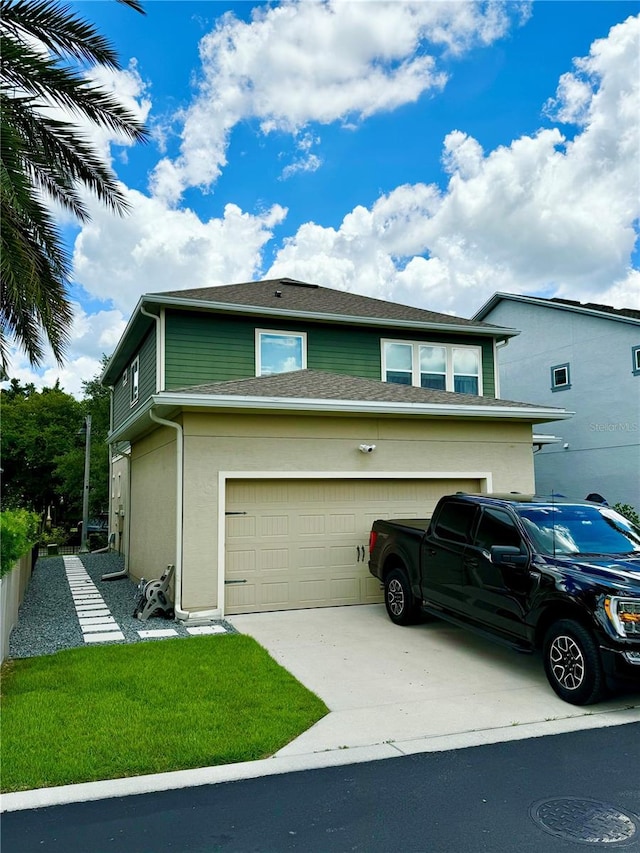 view of home's exterior with driveway and stucco siding