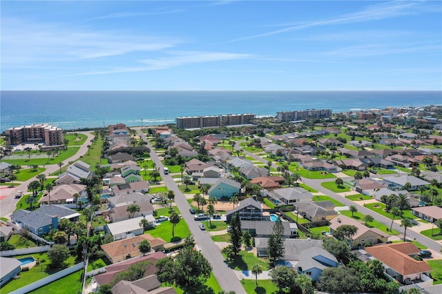 bird's eye view featuring a water view and a residential view