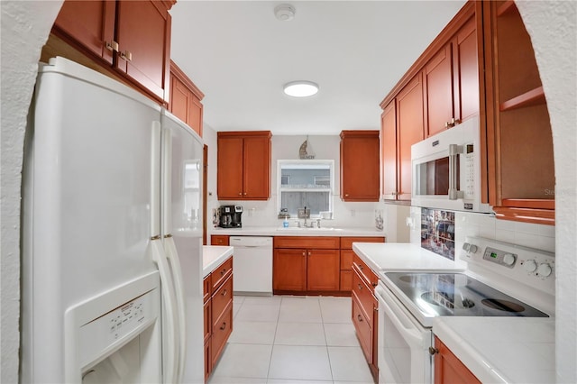 44 Capistrano Dr, Ormond Beach, FL 32176 - kitchen with white appliances, tasteful backsplash, light tile patterned floors, light countertops, and a sink