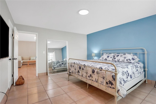 44 Capistrano Dr, Ormond Beach, FL 32176 - tiled bedroom with baseboards