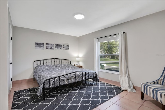 44 Capistrano Dr, Ormond Beach, FL 32176 - bedroom with tile patterned flooring and baseboards