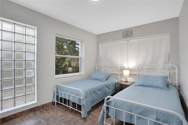 44 Capistrano Dr, Ormond Beach, FL 32176 - bedroom featuring tile patterned flooring and baseboards