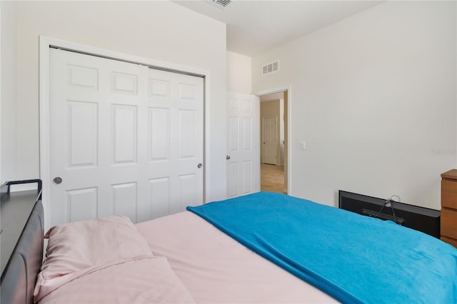 bedroom featuring a closet and visible vents