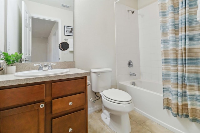 bathroom featuring tile patterned flooring, toilet, vanity, visible vents, and shower / bath combination with curtain