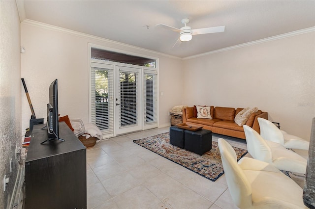 living area with ornamental molding, ceiling fan, and light tile patterned floors