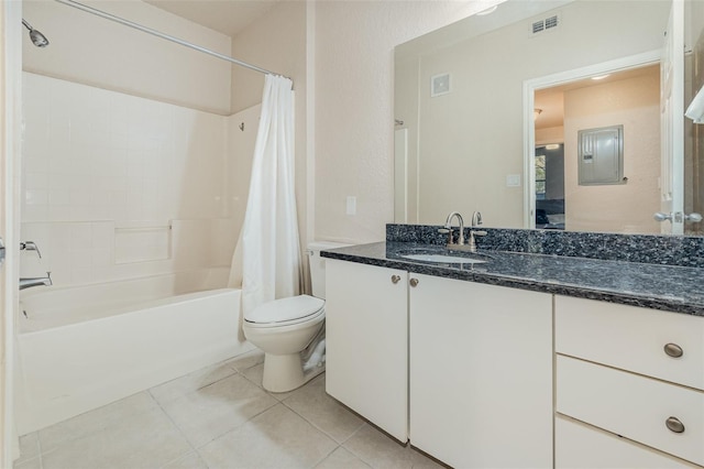 bathroom featuring toilet, visible vents, vanity, tile patterned floors, and shower / bath combo