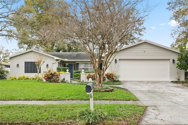 ranch-style home with driveway, stucco siding, an attached garage, and a front yard