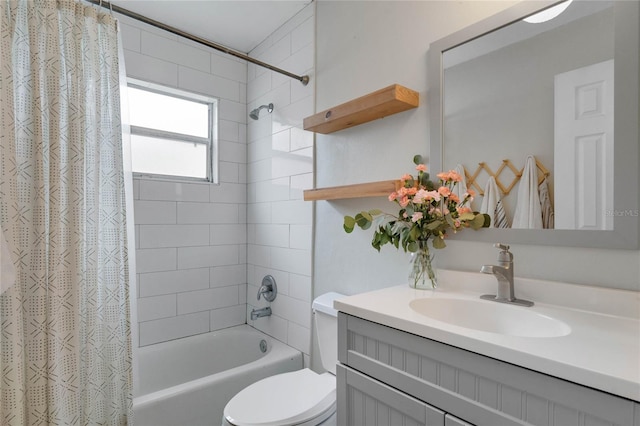 bathroom featuring vanity, shower / bath combination with curtain, and toilet