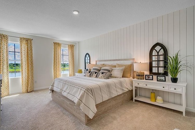 carpeted bedroom featuring a textured ceiling