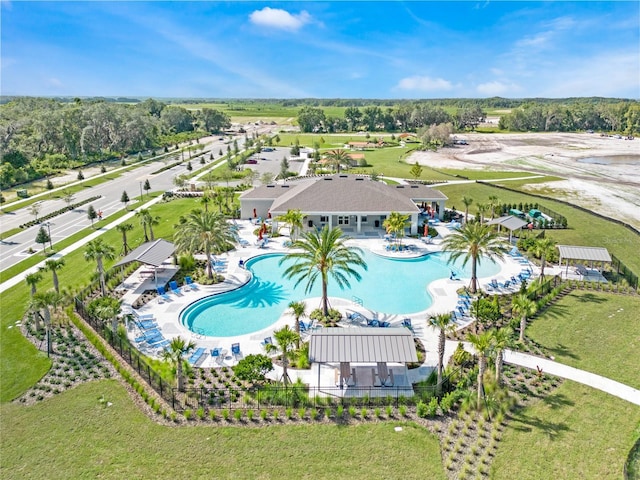 community pool featuring a patio area and fence