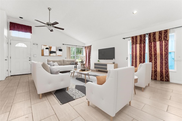 living area featuring ceiling fan, high vaulted ceiling, and recessed lighting