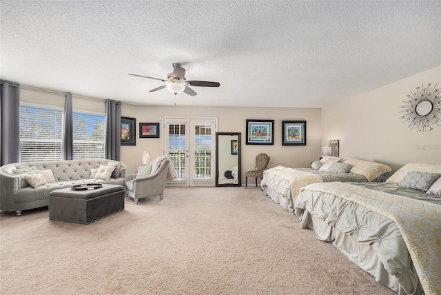 bedroom with french doors, a ceiling fan, light carpet, a textured ceiling, and access to outside