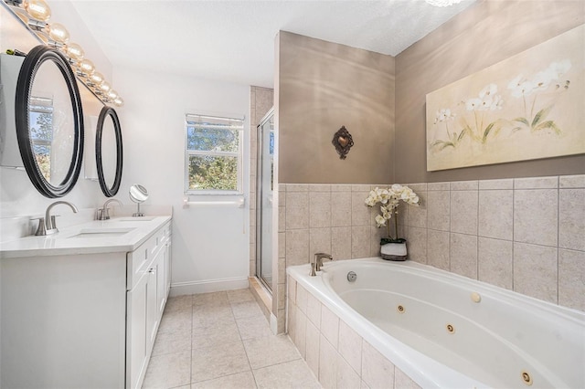 full bathroom with double vanity, a jetted tub, tile patterned flooring, a shower stall, and a sink