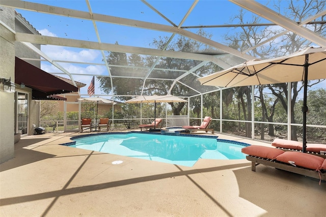 outdoor pool with glass enclosure and a patio