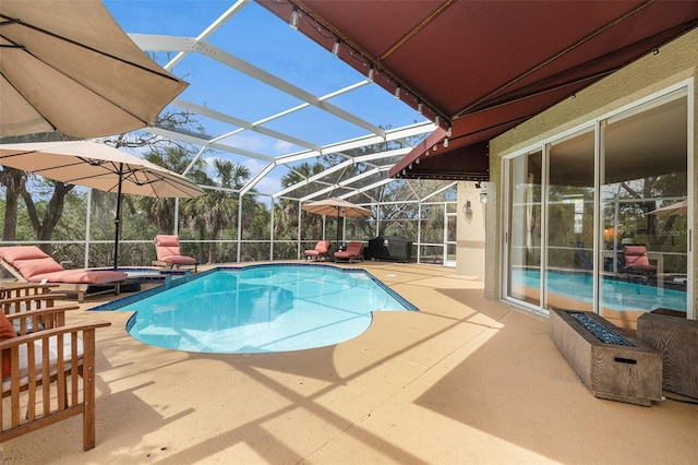 pool with glass enclosure and a patio