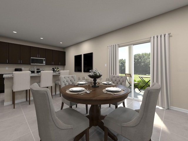 dining room with light tile patterned floors, baseboards, and recessed lighting