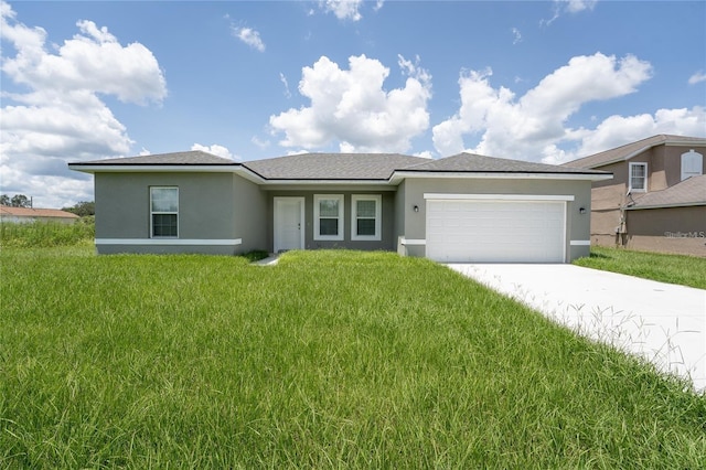 view of front of property featuring a garage, a front yard, driveway, and stucco siding