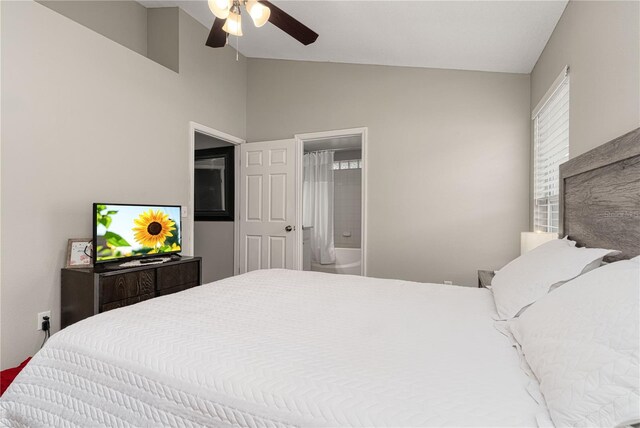 bedroom featuring vaulted ceiling, a ceiling fan, and ensuite bathroom