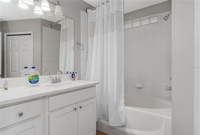 bathroom featuring shower / bath combination with curtain and vanity