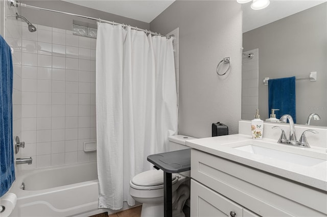 full bath with shower / bath combo, vanity, and toilet