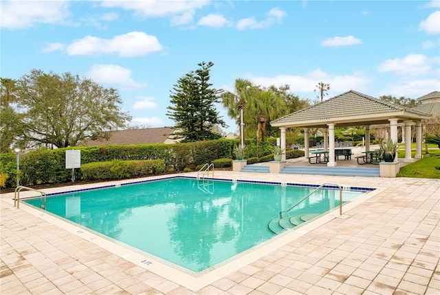 community pool featuring a patio area and a gazebo