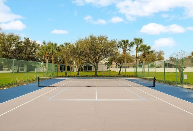 view of sport court with fence