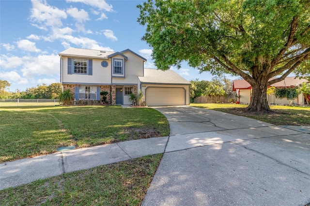 view of front of house featuring brick siding, concrete driveway, an attached garage, fence, and a front lawn