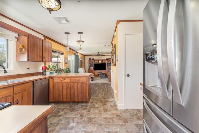 kitchen featuring brown cabinets, visible vents, stainless steel appliances, and a sink