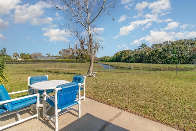 view of patio with outdoor dining space and a fenced backyard