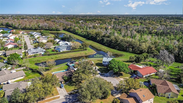 birds eye view of property with a water view and a residential view