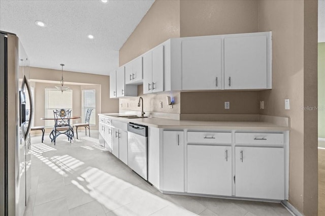 kitchen featuring a sink, light countertops, white cabinets, and stainless steel appliances