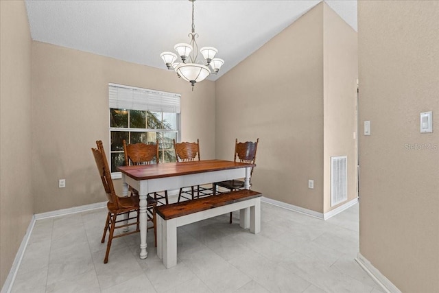 dining area with vaulted ceiling, a notable chandelier, baseboards, and visible vents