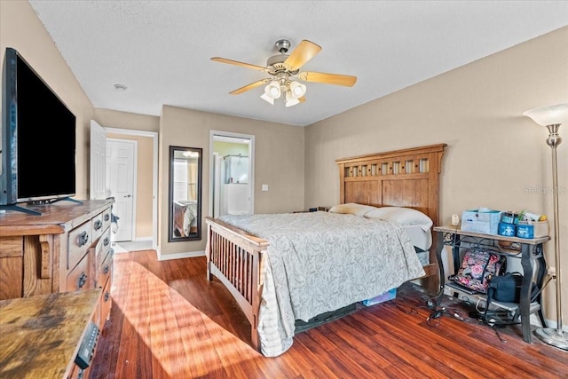 bedroom with wood finished floors and baseboards