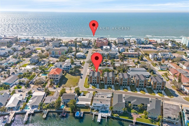 birds eye view of property with a water view and a residential view