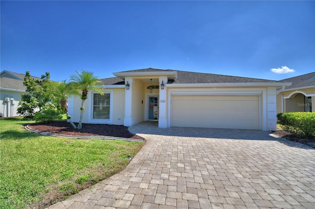 view of front facade featuring a shingled roof, stucco siding, a front lawn, a garage, and decorative driveway