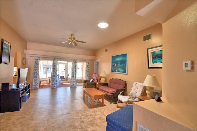 living area featuring visible vents and a ceiling fan