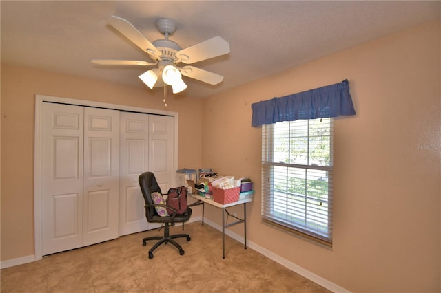 office featuring baseboards and a ceiling fan