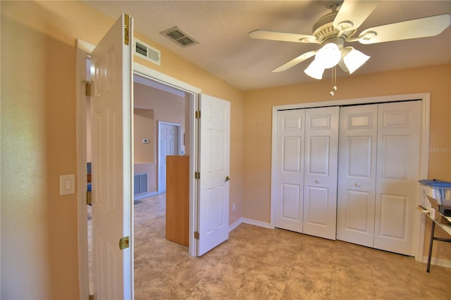 bedroom with visible vents, a closet, and ceiling fan