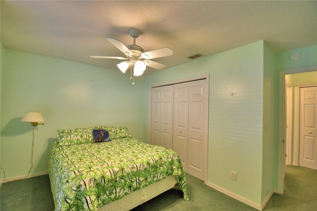 bedroom featuring a closet, baseboards, visible vents, and carpet floors