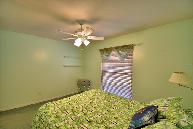 unfurnished bedroom featuring baseboards, carpet, and a ceiling fan