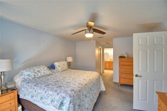 carpeted bedroom with visible vents and a ceiling fan