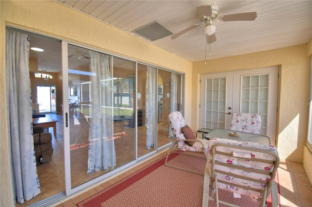 exterior space featuring visible vents, french doors, and a ceiling fan